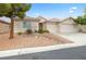 Charming single-story home with a two-car garage, desert landscaping, and a tile roof at 9539 Iris Flat Ct, Las Vegas, NV 89178