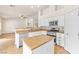Updated kitchen with white cabinets, stainless steel appliances, and center island at 9539 Iris Flat Ct, Las Vegas, NV 89178