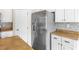 Close-up of kitchen with stainless steel appliances and white cabinets at 9539 Iris Flat Ct, Las Vegas, NV 89178