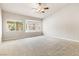 Spacious main bedroom with large windows and plush carpeting at 9539 Iris Flat Ct, Las Vegas, NV 89178