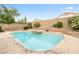 Inviting backyard pool with spa, surrounded by mature landscaping and a secure fence, creating a private retreat at 9539 Iris Flat Ct, Las Vegas, NV 89178