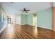Open-concept living area with hardwood floors and neutral paint at 9651 Bouncing Ball St, Las Vegas, NV 89178