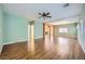 Spacious living room with hardwood floors, fan and neutral paint scheme at 9651 Bouncing Ball St, Las Vegas, NV 89178