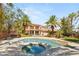 Inviting backyard with a pool, spa, and lush landscaping, perfect for outdoor entertaining at 2285 Villefort Ct, Las Vegas, NV 89117