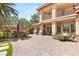 Beautiful backyard with covered patio, bar seating, lush greenery, and patio furniture at 2285 Villefort Ct, Las Vegas, NV 89117