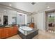 A luxury bathroom features a soaking tub, dual sinks, granite countertops, and ample lighting at 2285 Villefort Ct, Las Vegas, NV 89117