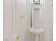 Bathroom pedestal sink with brushed nickel faucet and modern light fixture at 2285 Villefort Ct, Las Vegas, NV 89117