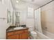 Well-lit bathroom with granite countertop, tub, and shower combination at 2285 Villefort Ct, Las Vegas, NV 89117