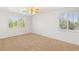 Bright bedroom with natural light from windows, neutral carpet, and ceiling fan at 2285 Villefort Ct, Las Vegas, NV 89117