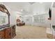 Spacious primary bedroom with carpet, sitting area, fireplace, and windows with shutters at 2285 Villefort Ct, Las Vegas, NV 89117