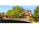 Charming two-story home with a three-car garage and lush green landscaping at 2285 Villefort Ct, Las Vegas, NV 89117