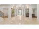 Beautiful foyer with tile flooring, decorative lighting, and an arched doorway at 2285 Villefort Ct, Las Vegas, NV 89117
