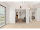 Elegant foyer featuring tile floors, decorative lighting, and an arched doorway at 2285 Villefort Ct, Las Vegas, NV 89117