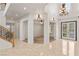 Grand foyer with tile flooring, staircase, and French doors providing ample natural light at 2285 Villefort Ct, Las Vegas, NV 89117