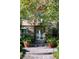 Charming front entrance featuring a stone facade, double doors, and manicured landscaping at 2285 Villefort Ct, Las Vegas, NV 89117