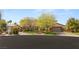 Inviting front exterior of a home with a lush lawn and three car garage at 2285 Villefort Ct, Las Vegas, NV 89117