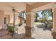 Inviting covered patio with seating area and view of landscaped backyard at 2285 Villefort Ct, Las Vegas, NV 89117