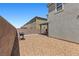 Spacious backyard featuring gravel landscaping and a barbecue at 2293 Teatro Ave, Henderson, NV 89044