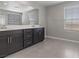 Bright bathroom with double vanity, ample counter space, and large mirror at 2293 Teatro Ave, Henderson, NV 89044