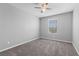 Cozy bedroom with neutral paint, carpet, and window letting in natural light at 2293 Teatro Ave, Henderson, NV 89044