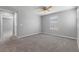 Spacious bedroom with plush carpet, natural light, and neutral paint at 2293 Teatro Ave, Henderson, NV 89044