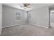 Bright bedroom with carpet, natural light from windows, and neutral walls at 2293 Teatro Ave, Henderson, NV 89044