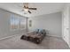 Bright bedroom featuring a ceiling fan and large windows, creating a cozy atmosphere at 2293 Teatro Ave, Henderson, NV 89044