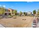 Community area featuring a bocce ball court with benches and lush landscaping at 2293 Teatro Ave, Henderson, NV 89044