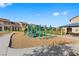 Community playground with play structures, benches, and Gathering seating at 2293 Teatro Ave, Henderson, NV 89044