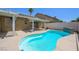 Sparkling pool surrounded by concrete patio with room for lounging; perfect backyard retreat at 315 Barletta Ave, Las Vegas, NV 89123
