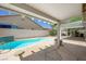 Inviting backyard pool area with covered patio and built-in grill, perfect for outdoor entertaining at 315 Barletta Ave, Las Vegas, NV 89123