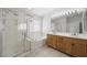 Bathroom featuring a double vanity, walk-in shower, and tub, providing a spa-like experience at 315 Barletta Ave, Las Vegas, NV 89123