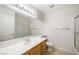 Bathroom with a large mirror, tile floors, and shower at 315 Barletta Ave, Las Vegas, NV 89123