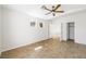 Bright bedroom with a fan, wood floors, and multiple doorways for easy access to different areas at 315 Barletta Ave, Las Vegas, NV 89123
