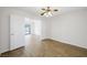 This bedroom features hardwood floors, ceiling fan, and easy access to the pool at 315 Barletta Ave, Las Vegas, NV 89123