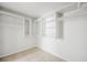 Walk-in closet has custom shelving, rods, and tile floors at 315 Barletta Ave, Las Vegas, NV 89123