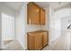 Well-lit hallway features tiled floors and built in cabinets for easy storage and organization at 315 Barletta Ave, Las Vegas, NV 89123