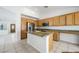 Kitchen featuring wood cabinets, stainless appliances, an island and eat-in counter at 315 Barletta Ave, Las Vegas, NV 89123