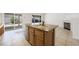 Bright kitchen island features stone countertops, wood cabinetry, and a stainless steel dishwasher at 315 Barletta Ave, Las Vegas, NV 89123