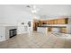 Open concept with fireplace, eat-in kitchen with wood cabinets and stainless appliances at 315 Barletta Ave, Las Vegas, NV 89123