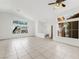 Open living room featuring tile flooring, abundant natural light and fan at 315 Barletta Ave, Las Vegas, NV 89123