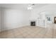 Bright living room featuring a fireplace, tile flooring and open floorplan at 315 Barletta Ave, Las Vegas, NV 89123