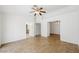 Spacious living room with hardwood floors, ceiling fan, and multiple entryways for flexible living at 315 Barletta Ave, Las Vegas, NV 89123