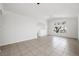 Bright living room with neutral tile flooring and large windows offering natural light at 315 Barletta Ave, Las Vegas, NV 89123