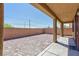 Covered back patio with ample space for outdoor seating and entertaining guests at 7137 Flowering Rose Ave, Las Vegas, NV 89117