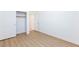 Clean bedroom with wood-look floors, a closet and lots of potential at 7137 Flowering Rose Ave, Las Vegas, NV 89117