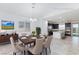 Virtually staged dining room with modern table, chairs, and stylish decor at 7137 Flowering Rose Ave, Las Vegas, NV 89117