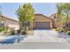 Charming single-story home featuring a stone facade and a well-maintained front yard with mature landscaping at 7137 Flowering Rose Ave, Las Vegas, NV 89117