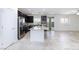 Open-concept kitchen featuring an island, stainless appliances, and easy access to backyard at 7137 Flowering Rose Ave, Las Vegas, NV 89117