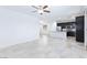 Open floor plan showcasing modern kitchen seamlessly connected to the spacious living area at 7137 Flowering Rose Ave, Las Vegas, NV 89117
